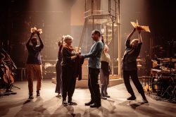 Cast of AN IMPROBABLE MUSICAL, Improbable Co. / Royal & Derngate co-production, the Royal Theatre, Northampton, and touring, 2022. Set and costume design: E.M. Parry. Directed by Lee Simpson and Ang Clerkin. Photo ©Marc Brenner