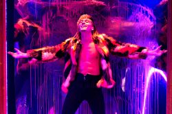 Andro Cowperthwaite in DORIAN, based on The Picture of Dorian Gray by Oscar Wilde, written by Phoebe Eclair-Powell & Owen Horsley. Set and costume design: E.M. Parry. Dir. by Owen Horsley. Reading Rep, 2021. Photo by Holly Revell.